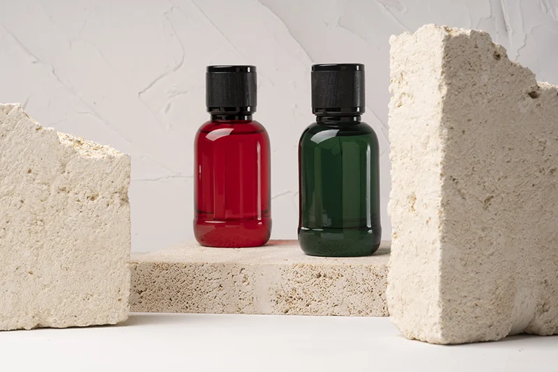 Glass bottles with wood caps displayed between stone blocks