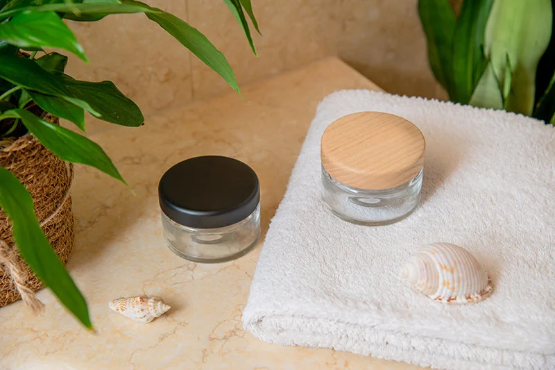 Glass jars with wood and black lids